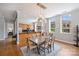 Elegant dining area featuring a modern pendant light fixture, hardwood floors, and seamless transition to the gourmet kitchen at 229 N Church St # 204, Charlotte, NC 28202