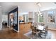 Open concept dining room with modern light fixture, breakfast bar, and windows offering natural light at 229 N Church St # 204, Charlotte, NC 28202