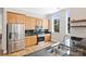 Modern kitchen with granite countertops, stainless steel appliances, and ample natural light streaming through large windows at 229 N Church St # 204, Charlotte, NC 28202