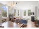 Open-concept living area features modern lighting and comfortable seating around a fireplace at 229 N Church St # 204, Charlotte, NC 28202