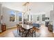 Bright and airy living room with large windows, fireplace, and dining area with modern lighting at 229 N Church St # 204, Charlotte, NC 28202