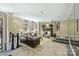 Classic living room with a fireplace, leather couches, neutral walls, and natural light from the arched windows at 229 N Church St # 204, Charlotte, NC 28202