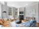 Cozy living space with modern furniture, fireplace, and natural light from large windows at 229 N Church St # 204, Charlotte, NC 28202