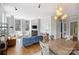 Bright living area with large windows, fireplace, and open access to a dining space at 229 N Church St # 204, Charlotte, NC 28202