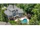 Aerial view of a home with pool, patio, deck, screened in porch, landscaping and a wooded surrounding at 238 Horton Grove Rd, Fort Mill, SC 29715