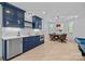 Stylish bar area with custom cabinetry, modern appliances, and adjacent dining area at 238 Horton Grove Rd, Fort Mill, SC 29715