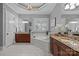 Luxurious bathroom with a corner soaking tub, granite counters, and dark wood cabinets at 238 Horton Grove Rd, Fort Mill, SC 29715