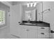 Clean bathroom with a white vanity, granite countertop, and black and white tile flooring at 238 Horton Grove Rd, Fort Mill, SC 29715