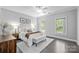Inviting bedroom with white bedding, neutral walls, and ample natural light from two windows at 238 Horton Grove Rd, Fort Mill, SC 29715