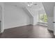 Bright and airy bedroom with dark wood floors, dormer window, and window seat at 238 Horton Grove Rd, Fort Mill, SC 29715