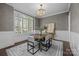 Dining area with neutral colored wallpaper, chandelier and large window at 238 Horton Grove Rd, Fort Mill, SC 29715