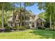 Beautiful two-story home with stone and siding exterior, complemented by lush landscaping and a well-manicured lawn at 238 Horton Grove Rd, Fort Mill, SC 29715