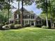 Beautiful stone and wood facade home with manicured lawn and mature trees at 238 Horton Grove Rd, Fort Mill, SC 29715
