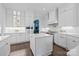 Modern kitchen with white cabinets, marble countertops, stainless steel appliances, and a center island at 238 Horton Grove Rd, Fort Mill, SC 29715