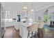 Bright kitchen with white cabinets, marble countertops, a large island, and stainless steel appliances at 238 Horton Grove Rd, Fort Mill, SC 29715