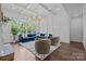 Well-lit living room with large windows, plush blue sofa, and stylish decor at 238 Horton Grove Rd, Fort Mill, SC 29715