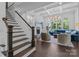 Bright living room featuring hardwood floors, large windows, and a fireplace at 238 Horton Grove Rd, Fort Mill, SC 29715