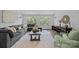 Cozy living room featuring a large sectional, natural light, and stylish decor at 238 Horton Grove Rd, Fort Mill, SC 29715