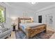 Comfortable main bedroom featuring a wooden bed frame, soft lighting, and a walk-in closet at 238 Horton Grove Rd, Fort Mill, SC 29715