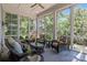 Relaxing sunroom with comfortable seating, large windows, and views of the outdoors at 238 Horton Grove Rd, Fort Mill, SC 29715