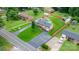 Expansive aerial view of a well-maintained home, showcasing lush landscaping, a long driveway and fenced backyard at 2401 Hillside Dr, Newton, NC 28658