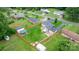 An aerial perspective of a residential property, highlighting the manicured lawn, fenced yard, and outbuildings at 2401 Hillside Dr, Newton, NC 28658