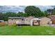 Well-kept backyard featuring a deck, gazebo, and ample green space at 2401 Hillside Dr, Newton, NC 28658