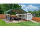 A practical backyard structure with metal carport, a shed, and a grassy yard perfect for storage and outdoor activities at 2401 Hillside Dr, Newton, NC 28658
