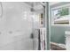 Bright bathroom featuring a glass-enclosed shower, a window, and neutral tones at 2401 Hillside Dr, Newton, NC 28658