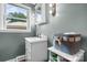 Bathroom featuring soft blue walls, classic fixtures, and a window providing natural light at 2401 Hillside Dr, Newton, NC 28658