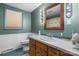 Traditional bathroom with wood vanity, and a window, providing good natural light at 2401 Hillside Dr, Newton, NC 28658