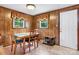Functional kitchen nook with a table, chairs, and natural light from the windows at 2401 Hillside Dr, Newton, NC 28658
