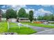 Spacious lot with a detached garage, white fence, and mature trees at 2401 Hillside Dr, Newton, NC 28658
