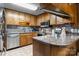 Well-lit kitchen featuring stainless steel appliances, wood cabinets, and a spacious countertop at 2401 Hillside Dr, Newton, NC 28658
