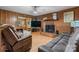 Cozy living room with a brick fireplace and wood-look flooring at 2401 Hillside Dr, Newton, NC 28658