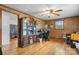 Home office featuring wood paneling, hardwood floors, and a large bookcase at 2401 Hillside Dr, Newton, NC 28658