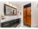 Charming bathroom featuring a modern vanity and stylish saloon doors at 2401 Hoffman St, Gastonia, NC 28054