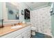 Bathroom featuring a white vanity, granite countertop, and butterfly shower curtain at 2401 Hoffman St, Gastonia, NC 28054