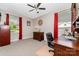 This bedroom has neutral walls, a ceiling fan, and red curtains for a cozy atmosphere at 2401 Hoffman St, Gastonia, NC 28054