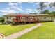 Charming home with a brick walkway leading to a lovely outdoor deck at 2401 Hoffman St, Gastonia, NC 28054