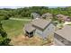 Rear of the home with a screened porch, fenced-in yard, and lush greenery at 2414 Madeira Cir, Waxhaw, NC 28173