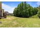Large backyard with a fence line and an area of trees at 2414 Madeira Cir, Waxhaw, NC 28173