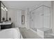 Bathroom featuring seamless glass shower with bench, tiled flooring, and vanity at 2414 Madeira Cir, Waxhaw, NC 28173