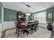 Elegant dining room with a large window, ornate chandelier, and stylish furnishings at 2414 Madeira Cir, Waxhaw, NC 28173