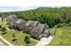 Two-story home with stone and siding, attached garage and a well-manicured lawn at 2414 Madeira Cir, Waxhaw, NC 28173