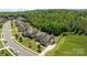 Two-story home with stone and siding, attached garage and a well-manicured lawn at 2414 Madeira Cir, Waxhaw, NC 28173