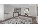 Hallway featuring hardwood floors, staircase, decorative rug, and console table at 2414 Madeira Cir, Waxhaw, NC 28173