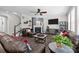 Comfortable living room featuring a fireplace, TV, and staircase access at 2414 Madeira Cir, Waxhaw, NC 28173