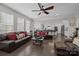 Open concept living room and kitchen with comfortable seating, bright light, and modern appliances at 2414 Madeira Cir, Waxhaw, NC 28173