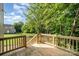 Newly constructed wooden deck with stairs overlooking a leafy backyard at 304 Adams St, Salisbury, NC 28144